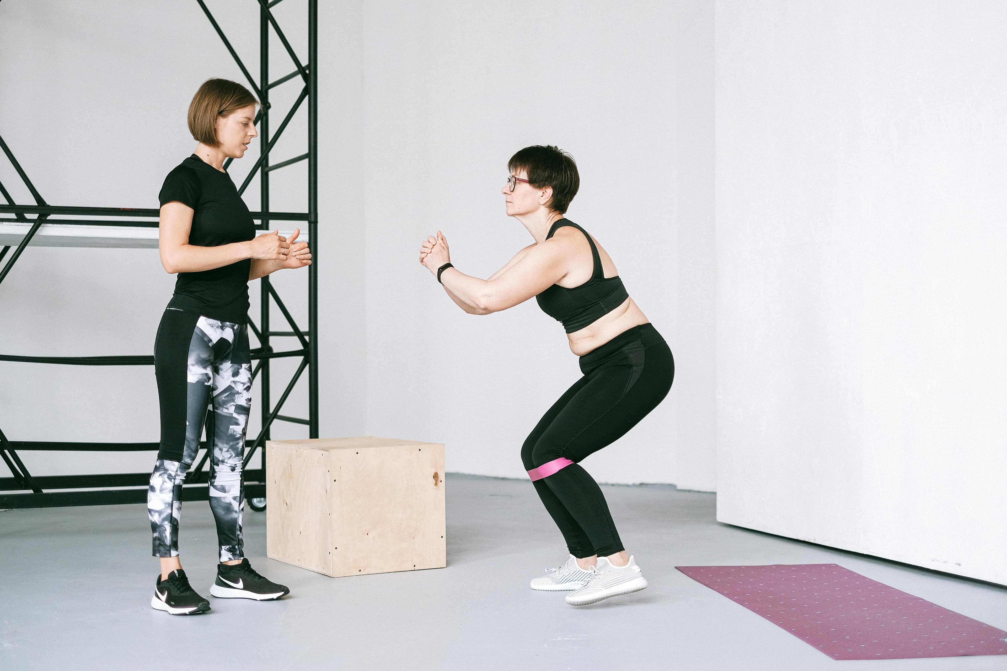 Personal trainer coaching a client